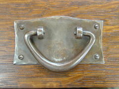 Close-up original hand-hammered iron pull.